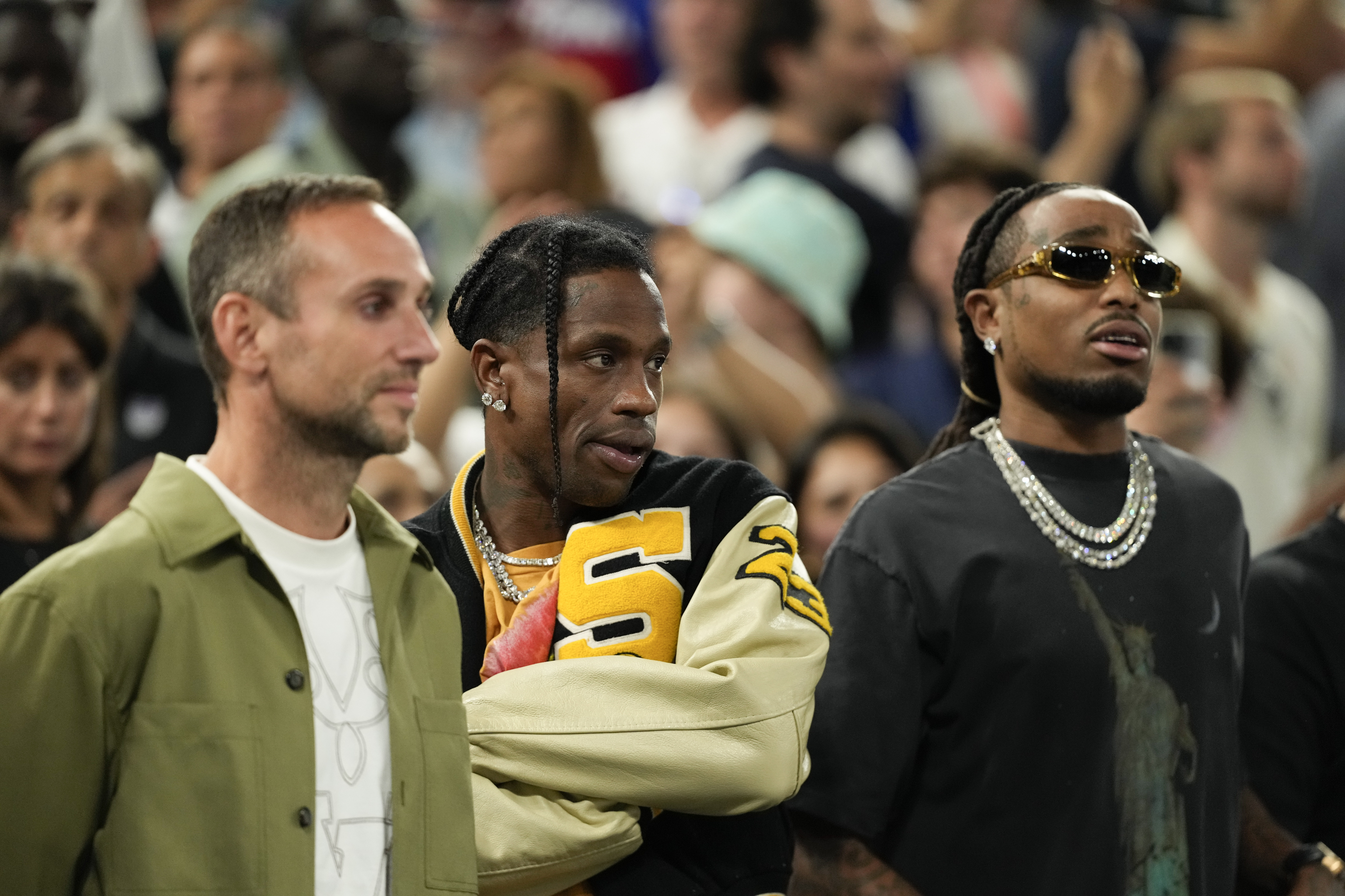 Travis Scott watches the Serbia vs' United States game during a men's semifinals basketball game at Bercy Arena at the 2024 Summer Olympics, Thursday, Aug. 8, 2024, in Paris, France. (AP Photo/Mark J. Terrill)