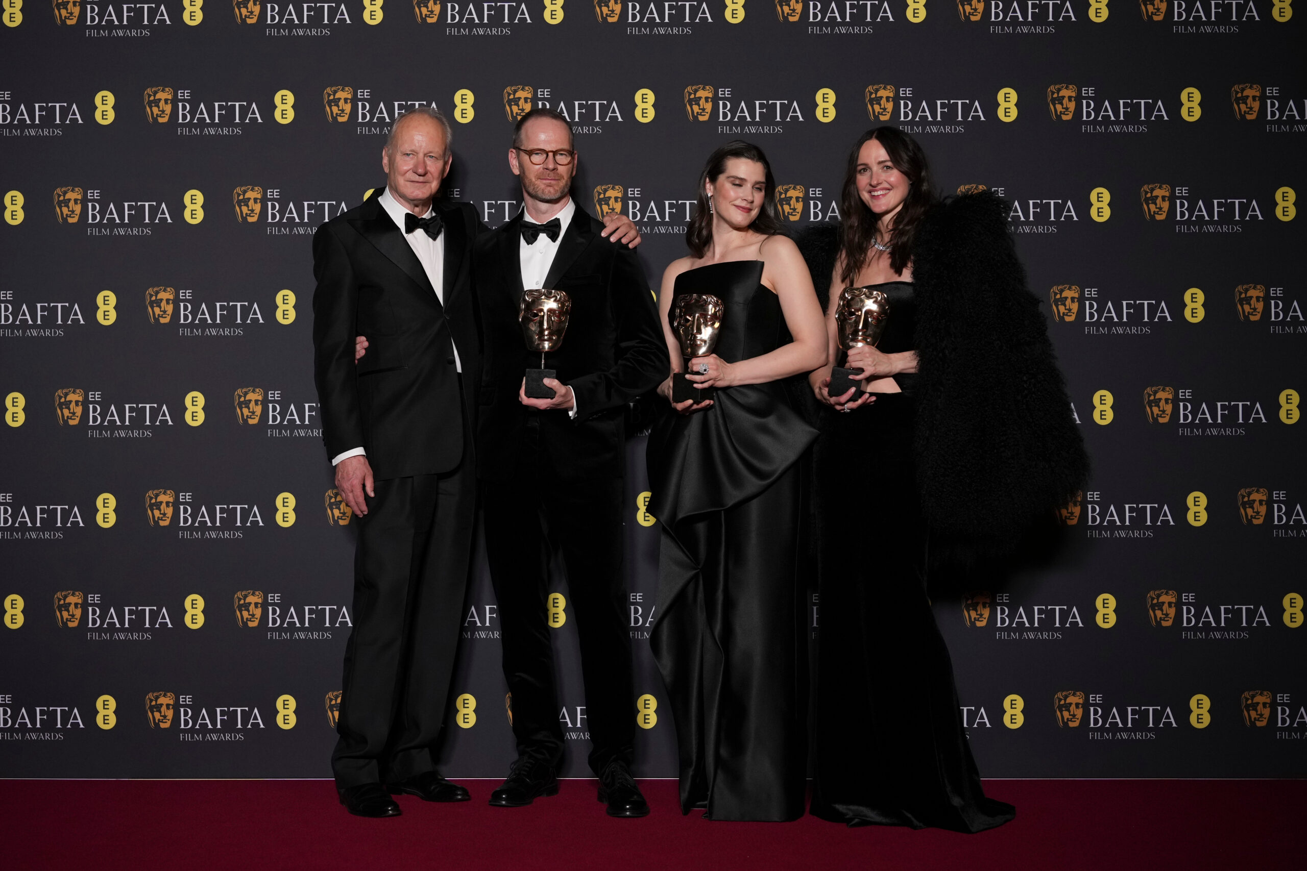 Stellan Skarsgård, from left, Joachim Trier, Inga Ibsdotter Lilleaas, and Renate Reinsve pose with the award for film not in the English language for 'Sentimental Value' at the 79th British Academy Film Awards, BAFTA's, in London, Sunday, Feb. 22, 2026. (AP Photo/Alastair Grant)