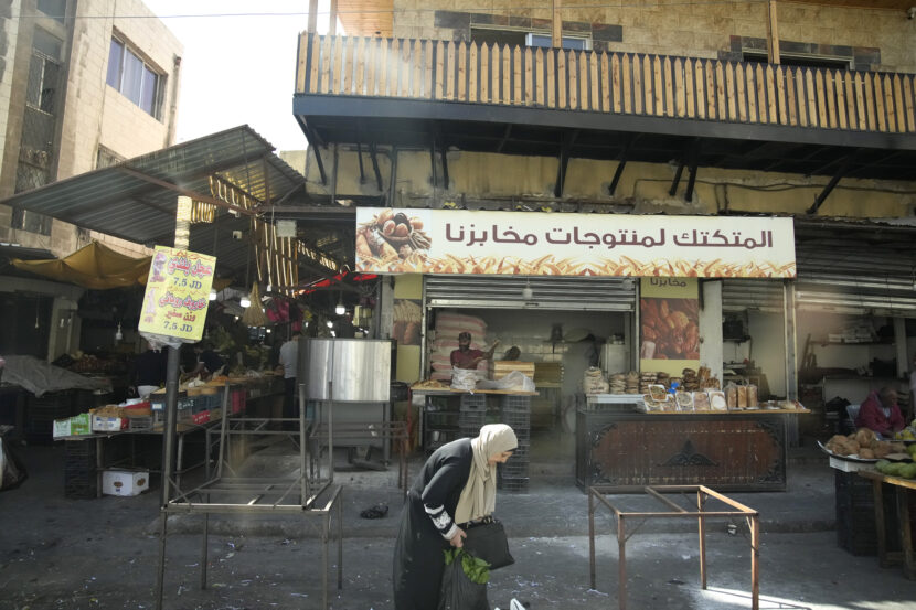 A woman shops in Amman, Jordan, Wednesday, Oct. 25, 2023. French President Emmanuel Macron met Tuesday with Israeli Prime Minister Benjamin Netanyahu in Jerusalem and with Jordan King Abdullah II today in Amman. (AP Photo/Christophe Ena, Pool)